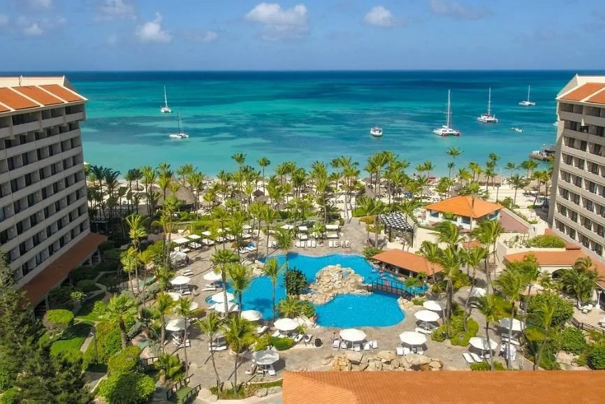 Aruba Hotel Guide: A sprawling ariel view of the seaside Barcelo Aruba resort complex.