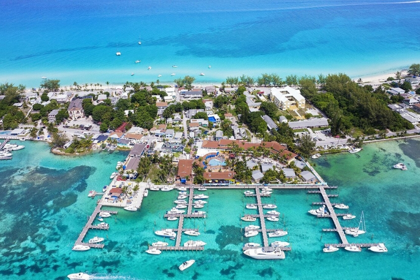 Bimini Big Game Club Resort & Marina in the Bahamas featuring full-service marina with docked boats, resort amenities, beachfront location, turquoise Caribbean water, and coastal island setting
