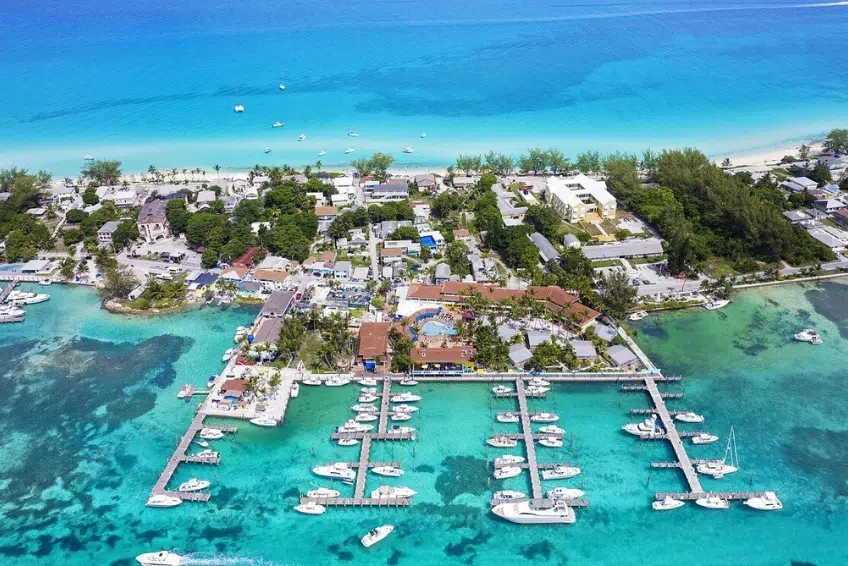 Bimini Big Game Club Resort & Marina in the Bahamas featuring full-service marina with docked boats, resort amenities, beachfront location, turquoise Caribbean water, and coastal island setting